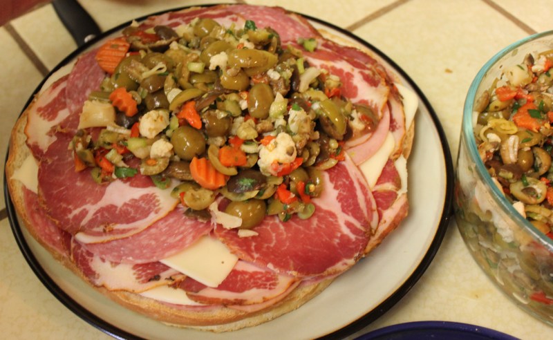 Start of the meat muffuletta. In the end, it had waaaaay more olive salad on top.