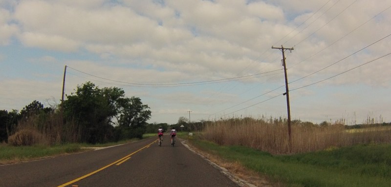 Two riders in matching outfits.