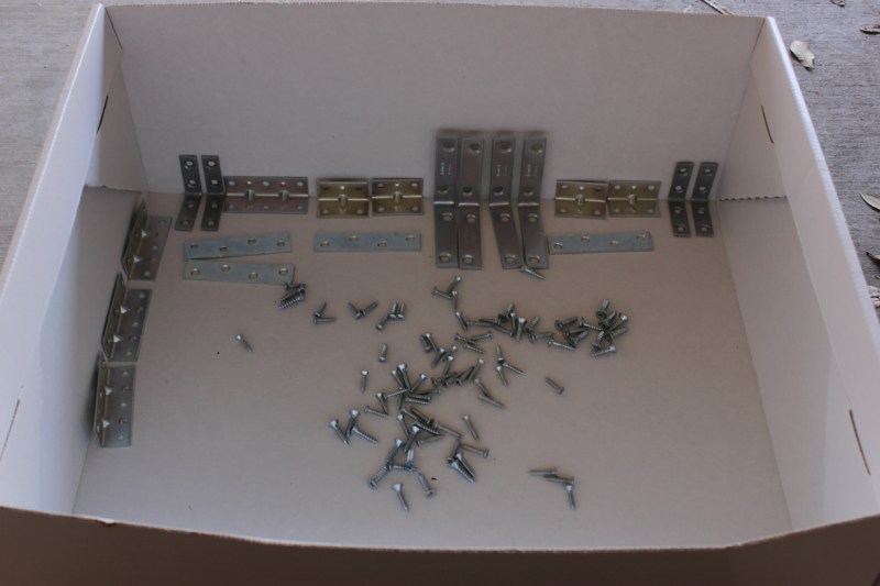 Spray painting the brackets and screws.