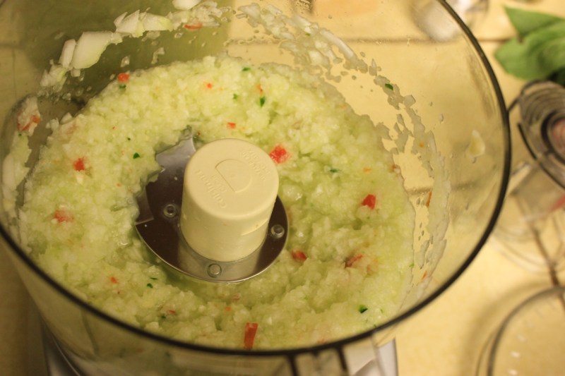 Combine cucumbers and peppers (and onion if you're using it) in a food processor